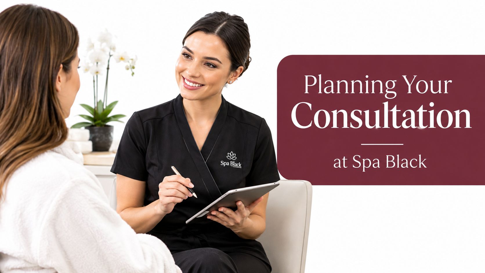A professional spa consultant talks to a client during a skin consultation at Spa Black.